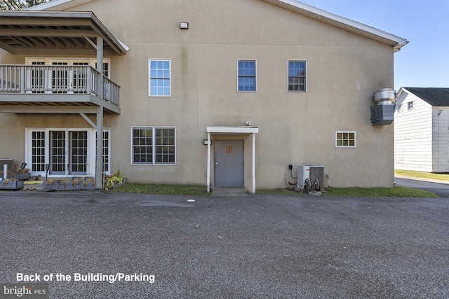 3 Howell Point Rd, Betterton, MD 21610 - rear view of property featuring stucco siding, central AC, and a balcony