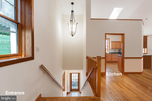 3 Howell Point Rd, Betterton, MD 21610 - staircase with a skylight, a high ceiling, hardwood / wood-style floors, and plenty of natural light
