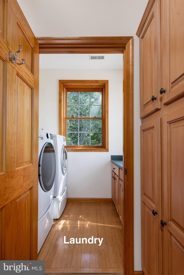 3 Howell Point Rd, Betterton, MD 21610 - washroom with washing machine and dryer, light wood finished floors, and baseboards