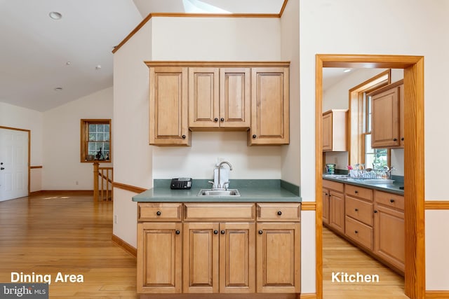 3 Howell Point Rd, Betterton, MD 21610 - kitchen featuring a sink, light wood-type flooring, dark countertops, lofted ceiling, and baseboards