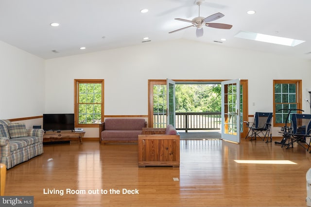 3 Howell Point Rd, Betterton, MD 21610 - living area with wood finished floors, lofted ceiling, a skylight, a ceiling fan, and recessed lighting