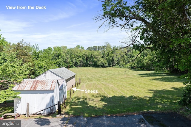 3 Howell Point Rd, Betterton, MD 21610 - view of green lawn with an outbuilding and a wooded view