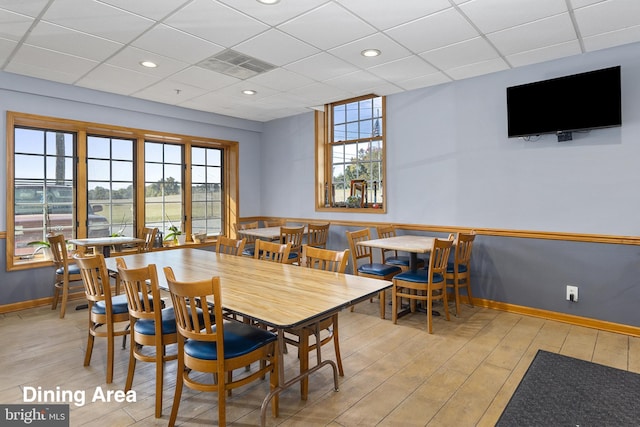3 Howell Point Rd, Betterton, MD 21610 - dining area featuring healthy amount of natural light, wood finished floors, a paneled ceiling, and baseboards