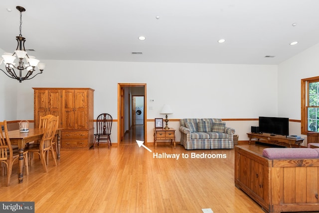 3 Howell Point Rd, Betterton, MD 21610 - living room featuring a chandelier, washer / clothes dryer, light wood-style flooring, and recessed lighting