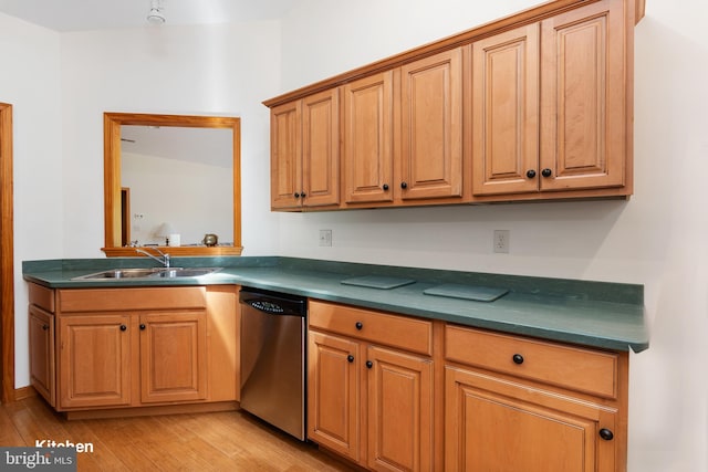 3 Howell Point Rd, Betterton, MD 21610 - kitchen featuring stainless steel dishwasher, a sink, dark countertops, light wood-style flooring, and brown cabinetry