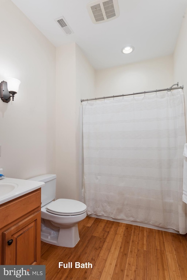 3 Howell Point Rd, Betterton, MD 21610 - bathroom featuring toilet, wood finished floors, vanity, and a shower with shower curtain