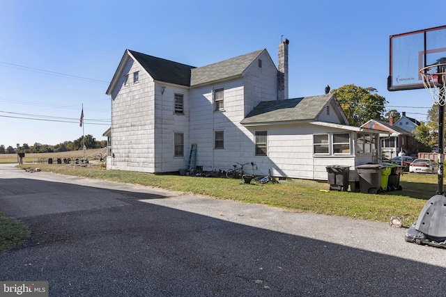 3 Howell Point Rd, Betterton, MD 21610 - view of side of property with roof with shingles and a chimney
