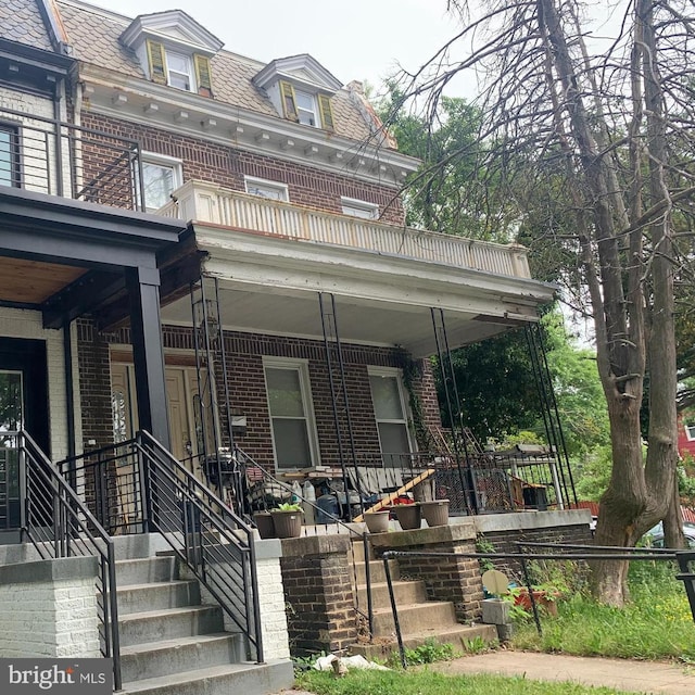 4101 Illinois Ave NW, Washington, DC 20011 - view of front of house with brick siding, covered porch, and mansard roof