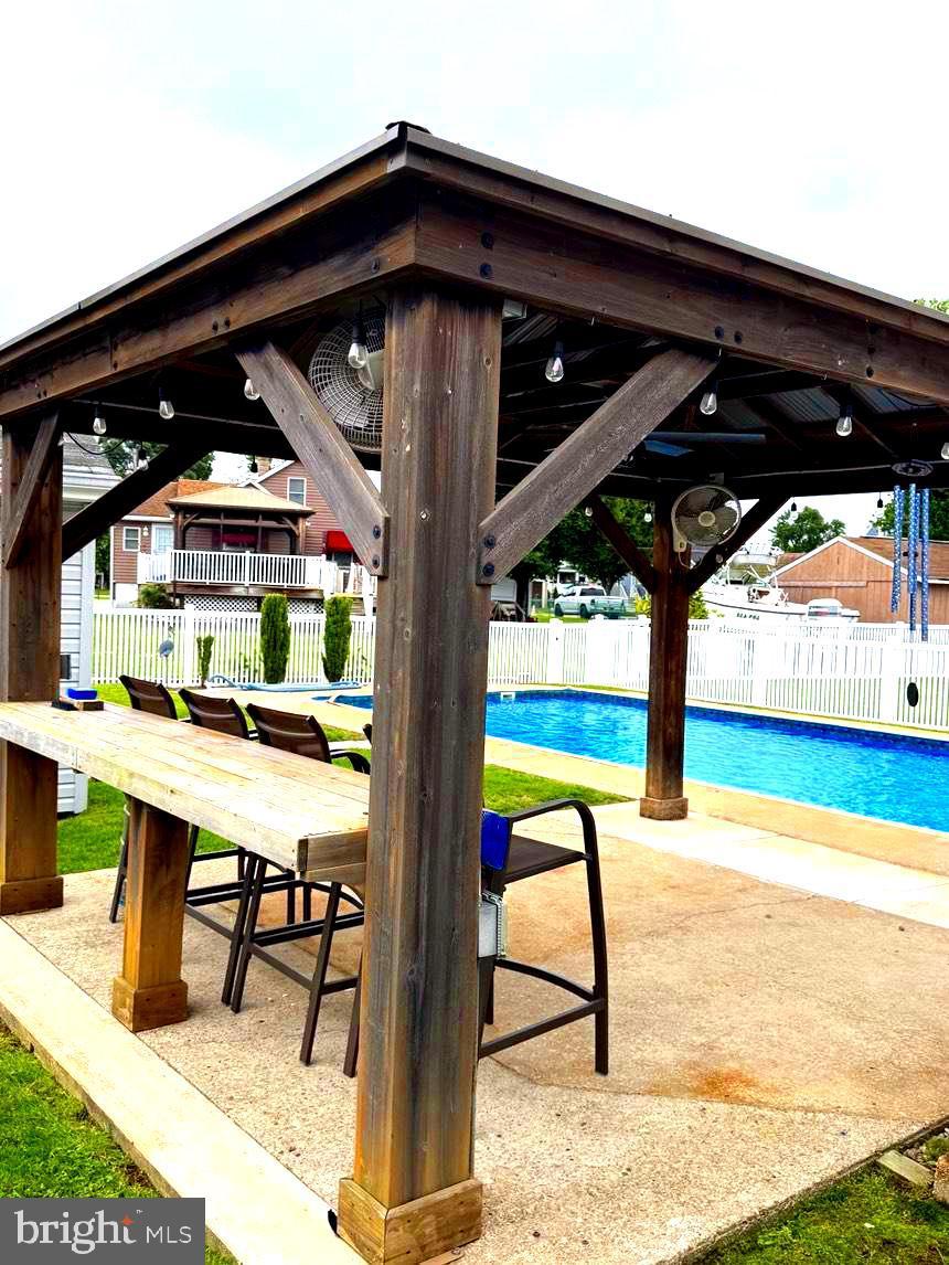 17 Winona Ave, Baltimore, MD 21222 - view of property's community featuring a pool, a gazebo, a bar, and a patio area