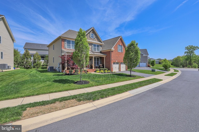 1504 Willow Branch Way, Severn, MD 21144 - view of front of property with central AC, a standing seam roof, a garage, concrete driveway, and a front lawn