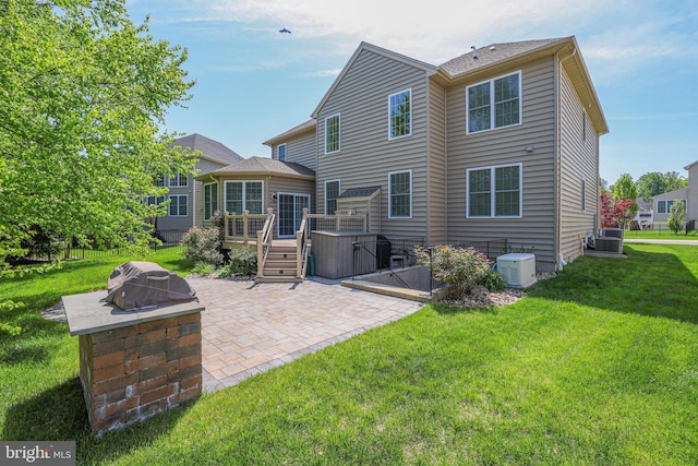 1504 Willow Branch Way, Severn, MD 21144 - rear view of house featuring a patio, a deck, a yard, central AC, and an outdoor fire pit
