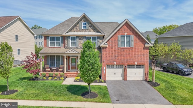 1504 Willow Branch Way, Severn, MD 21144 - view of front of house featuring brick siding, covered porch, driveway, and a front yard