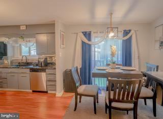 22 Erbitea Ln, New Castle, DE 19720 - dining space with a chandelier and light wood-type flooring