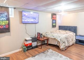 22 Erbitea Ln, New Castle, DE 19720 - bedroom featuring wood finished floors, baseboards, and a drop ceiling