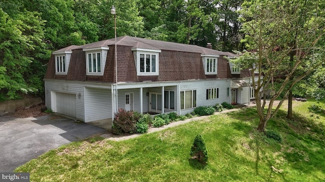 1236 Wood Rd, Hummelstown, PA 17036 - view of front of property with a shingled roof, driveway, a front lawn, an attached garage, and a gambrel roof