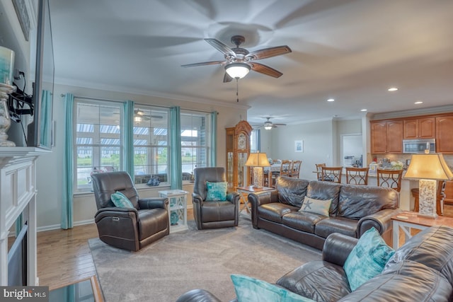 38623 Longs Chapel Ln, Millville, DE 19967 - living area with ornamental molding, a ceiling fan, recessed lighting, light wood-style flooring, and a fireplace with flush hearth