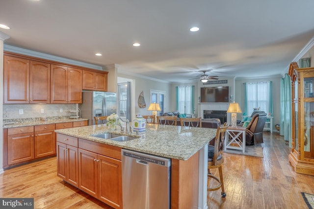 38623 Longs Chapel Ln, Millville, DE 19967 - kitchen featuring appliances with stainless steel finishes, a sink, crown molding, a kitchen island with sink, and ceiling fan