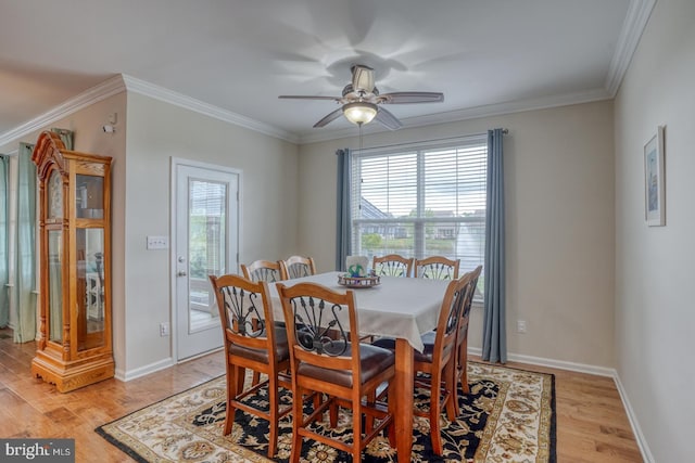 38623 Longs Chapel Ln, Millville, DE 19967 - dining space featuring light wood finished floors, crown molding, ceiling fan, and baseboards