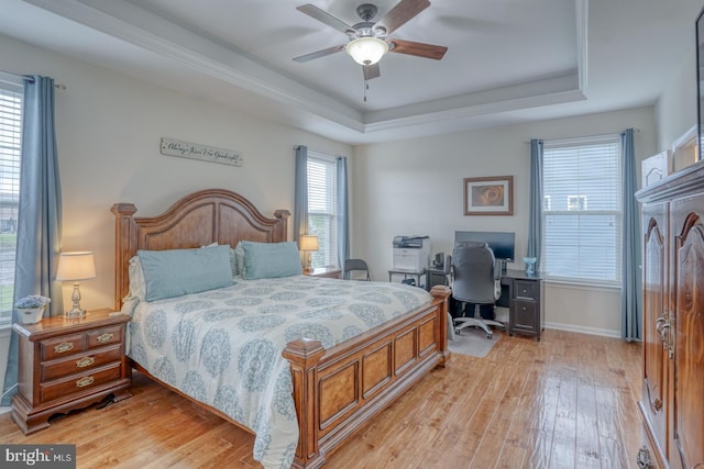 38623 Longs Chapel Ln, Millville, DE 19967 - bedroom featuring a raised ceiling, light wood-style floors, baseboards, and ceiling fan