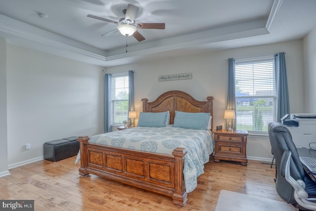 38623 Longs Chapel Ln, Millville, DE 19967 - bedroom with a tray ceiling, light wood-type flooring, baseboards, and a ceiling fan