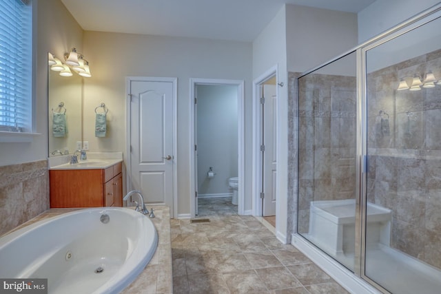 38623 Longs Chapel Ln, Millville, DE 19967 - full bath featuring a stall shower, vanity, a jetted tub, and toilet