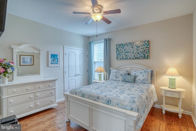 38623 Longs Chapel Ln, Millville, DE 19967 - bedroom featuring a closet, wood finished floors, and baseboards