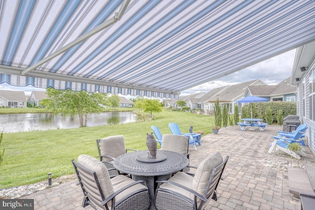 38623 Longs Chapel Ln, Millville, DE 19967 - view of patio / terrace with outdoor dining space, a water view, and a residential view