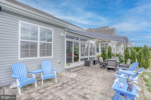 38623 Longs Chapel Ln, Millville, DE 19967 - view of patio / terrace with outdoor dining space and a sunroom