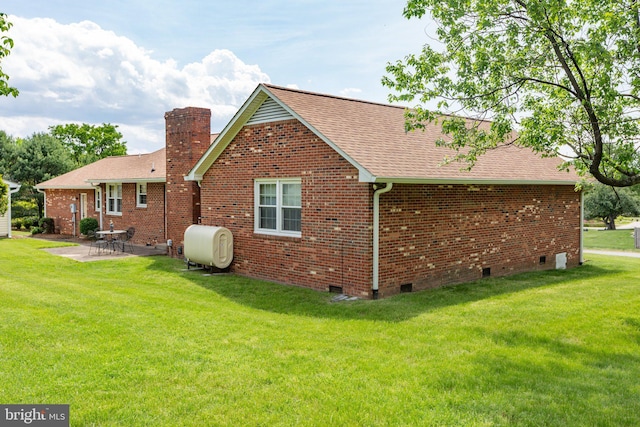113 Kendallwood Dr, Fredericksburg, VA 22405 - back of house featuring crawl space, oil tank, roof with shingles, a patio area, and brick siding
