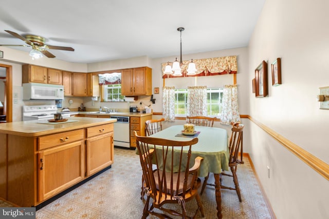 113 Kendallwood Dr, Fredericksburg, VA 22405 - kitchen with white appliances, a ceiling fan, light countertops, light floors, and a center island
