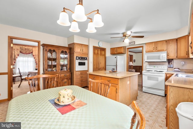 113 Kendallwood Dr, Fredericksburg, VA 22405 - kitchen featuring white appliances, a center island, light countertops, and a chandelier