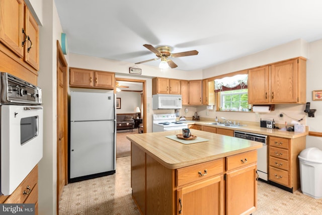 113 Kendallwood Dr, Fredericksburg, VA 22405 - kitchen featuring white appliances, a sink, light floors, ceiling fan, and a center island