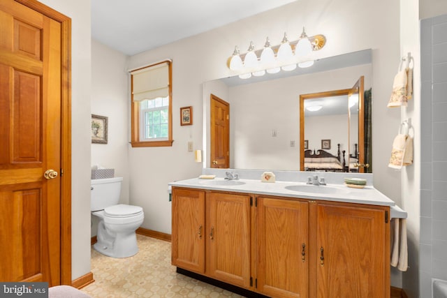 113 Kendallwood Dr, Fredericksburg, VA 22405 - bathroom featuring double vanity, ensuite bathroom, toilet, and tile patterned floors