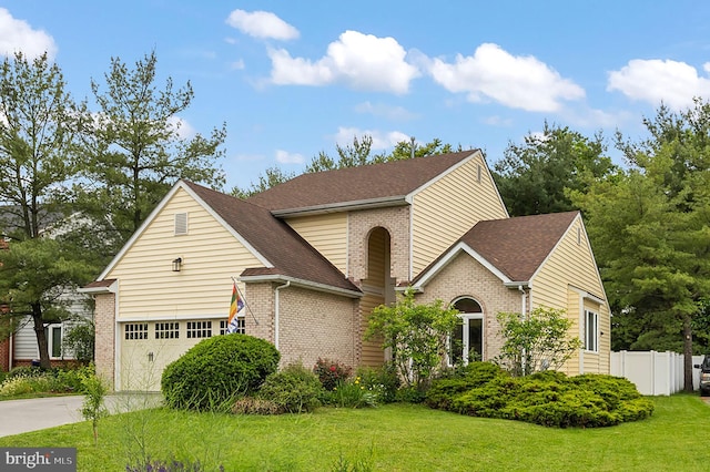 419 Westside Station Dr, Winchester, VA 22601 - traditional-style house with brick siding, concrete driveway, roof with shingles, and a garage