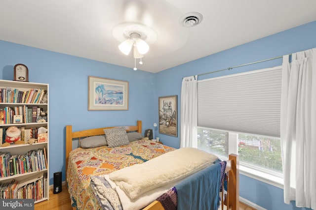 419 Westside Station Dr, Winchester, VA 22601 - bedroom with wood finished floors, baseboards, and a ceiling fan