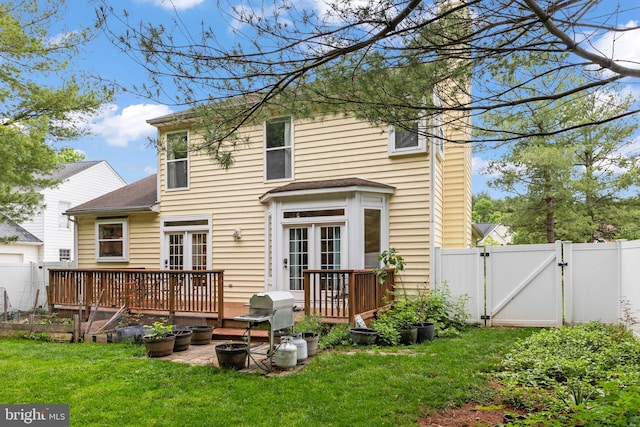 419 Westside Station Dr, Winchester, VA 22601 - back of house featuring a gate, a wooden deck, roof with shingles, a chimney, and a vegetable garden
