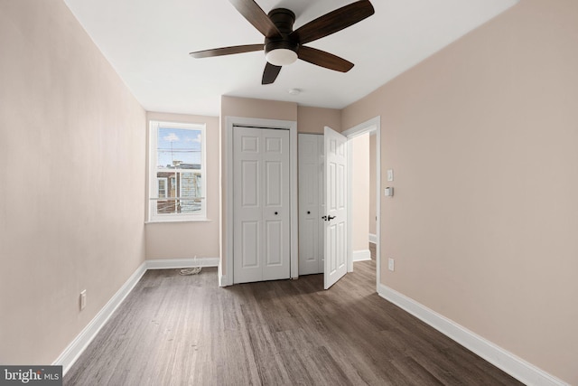 2032 S 21st St, Philadelphia, PA 19145 - unfurnished bedroom featuring wood finished floors, baseboards, and a ceiling fan
