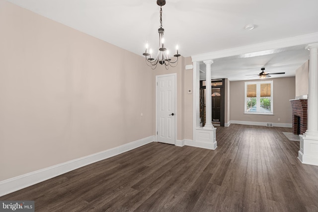 2032 S 21st St, Philadelphia, PA 19145 - unfurnished dining area with a brick fireplace, dark wood-style flooring, a ceiling fan, and ornate columns