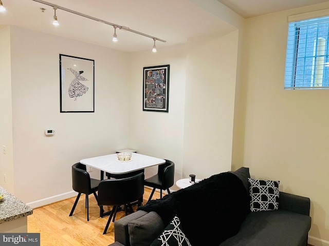 1314 Massachusetts Ave NW Unit G04, Washington, DC 20005 - dining space featuring track lighting, light wood-style floors, and baseboards