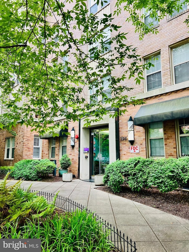 1314 Massachusetts Ave NW Unit G04, Washington, DC 20005 - doorway to property featuring brick siding