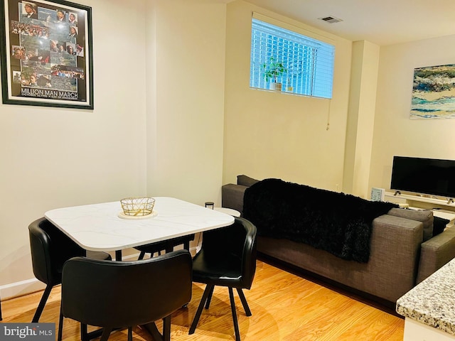 1314 Massachusetts Ave NW Unit G04, Washington, DC 20005 - dining room with light wood-style flooring and baseboards