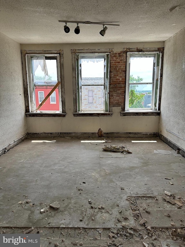 1042 Edmondson Ave, Baltimore, MD 21223 - spare room featuring track lighting