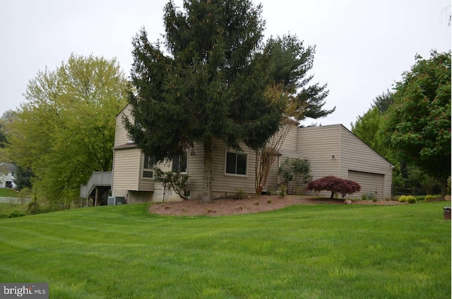 7 Huntmeadow Ct, Owings Mills, MD 21117 - view of side of home with a lawn and an attached garage