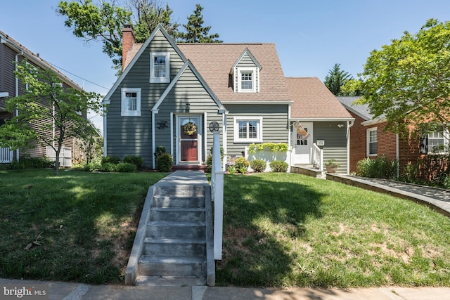 336 Miller St, Winchester, VA 22601 - view of front of home with a front lawn, roof with shingles, and a chimney