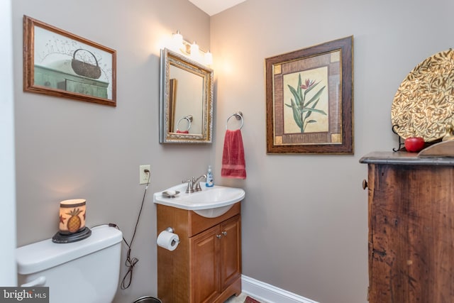 336 Miller St, Winchester, VA 22601 - half bath with vanity, toilet, and baseboards