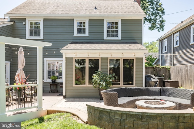 336 Miller St, Winchester, VA 22601 - rear view of house featuring an outdoor fire pit, roof with shingles, a deck, and a patio area