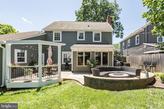 336 Miller St, Winchester, VA 22601 - back of house with an outdoor fire pit, a chimney, a shingled roof, a deck, and a patio