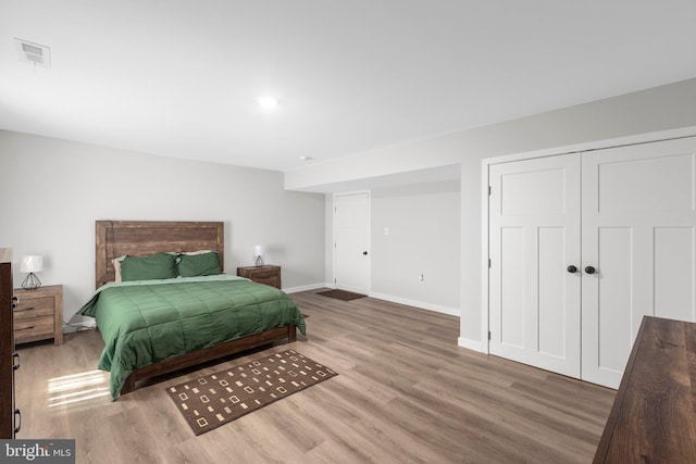 12037 Angora Dr, King George, VA 22485 - bedroom featuring wood finished floors, baseboards, and a closet