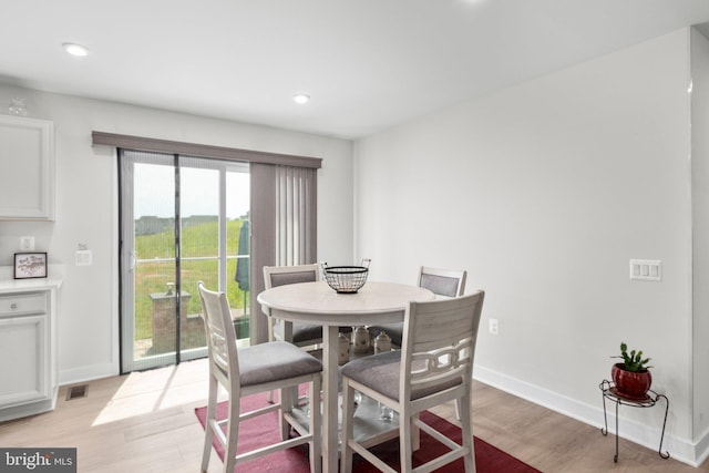 12037 Angora Dr, King George, VA 22485 - dining area with light wood-style floors, recessed lighting, and baseboards