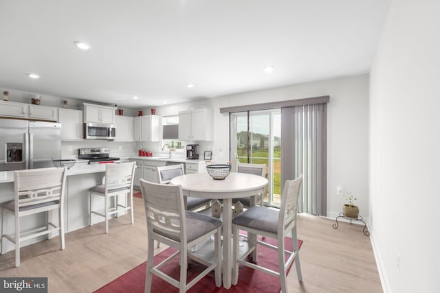12037 Angora Dr, King George, VA 22485 - dining area featuring light wood-type flooring, recessed lighting, and baseboards